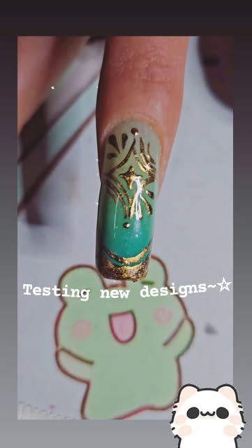 An ornate hand-painted test design in the Kitty Clawz studio